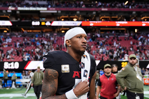 Atlanta Falcons quarterback Michael Penix Jr. (9) walks of the field after overtime of an NFL football game against the Carolina Panthers, Sunday, Nov. 16, 2025, in Atlanta. (AP Photo/Brynn Anderson)
