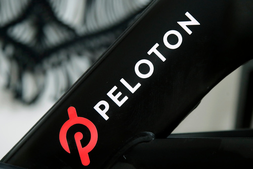 FILE - The Peloton logo is seen on the company's stationary bicycle in San Francisco, Calif., Nov. 19, 2019. (AP Photo/Jeff Chiu, File)