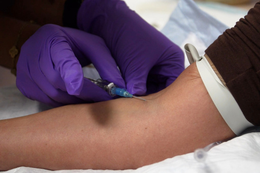 In this image taken from video, an IV infusion is administered at Pure Alchemy Wellness, Tuesday, Nov. 11, 2025, in Chula Vista, Calif. (AP Photo/Javier Arciga)