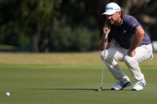 Andrew Novak lines up a putt on the nineth green during the second round of the RSM Classic golf tournament, Friday, Nov. 21, 2025, in St. Simons Island, Ga. (AP Photo/Mike Stewart)