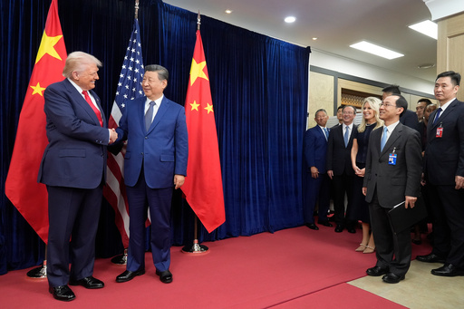 President Donald Trump, left, and Chinese President Xi Jinping shake hands before their meeting at Gimhae International Airport in Busan, South Korea, Thursday, Oct. 30, 2025. (AP Photo/Mark Schiefelbein)