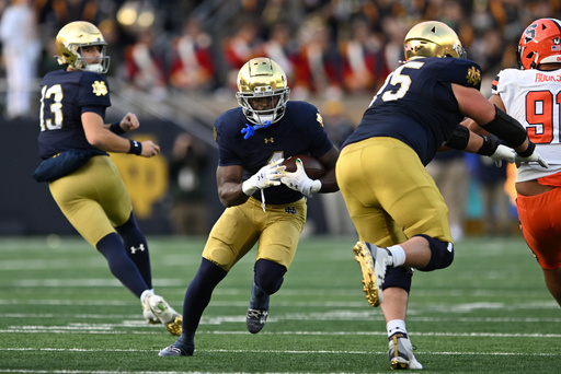 Notre Dame running back Jeremiyah Love (4) rushes during the first quarter of an NCAA football game against Syracuse, Saturday, Nov. 22, 2025, in South Bend, Ind. (AP Photo/Paul Beaty)