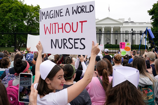 FILE - People protest outside the White House in Washington, May 12, 2022. (AP Photo/Susan Walsh)