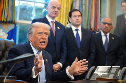 President Donald Trump answers questions from reporters during a meeting with the White House task force on the 2026 FIFA World Cup in the Oval Office of the White House, Monday, Nov. 17, 2025, in Washington, as FIFA President Gianni Infantino, Secretary of State Marco Rubio and FIFA senior adviser Carlos Cordeiro listen. (AP Photo/Evan Vucci)