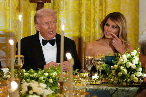 President Donald Trump and first lady Melania Trump attend a dinner with Saudi Arabia's Crown Prince Mohammed bin Salman in the East Room of the White House, Tuesday, Nov. 18, 2025, in Washington. (AP Photo/Alex Brandon)