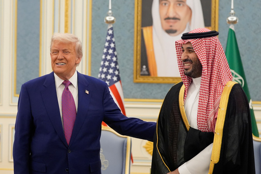 FILE - President Donald Trump and Saudi Crown Prince Mohammed bin Salman gesture as they meet delegations at the Royal Palace in Riyadh, Saudi Arabia, May 13, 2025. (AP Photo/Alex Brandon, File)