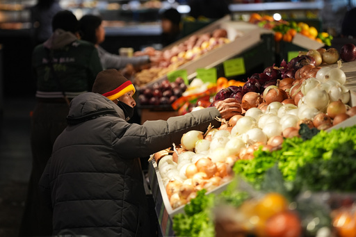 Customers shop at the Reading Terminal Market in Philadelphia, Wednesday, Oct. 29, 2025. (AP Photo/Matt Rourke)