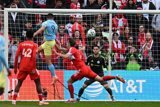 Philadelphia Union's Tai Baribo (9) scores a goal against Chicago Fire goalie Jeffrey Gal during the first half of an MLS soccer playoff match Saturday, Nov. 1, 2025, in Bridgeview, Ill. (AP Photo/Paul Beaty)