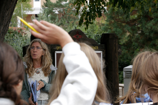 Lisa Nordstrum, a history teacher at Santa Fe Preparatory School, asks questions during a field trip with her seventh-grade history class Wednesday, Oct. 8, 2025, in Santa Fe, N.M. (AP Photo/Stacy Thacker)